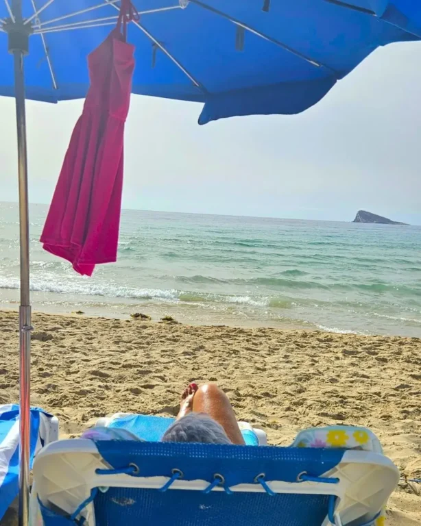 Sunbather on Poniente Beach, Benidorm.